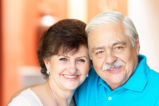 Senior couple smiling, residents of subsidized independent living. 